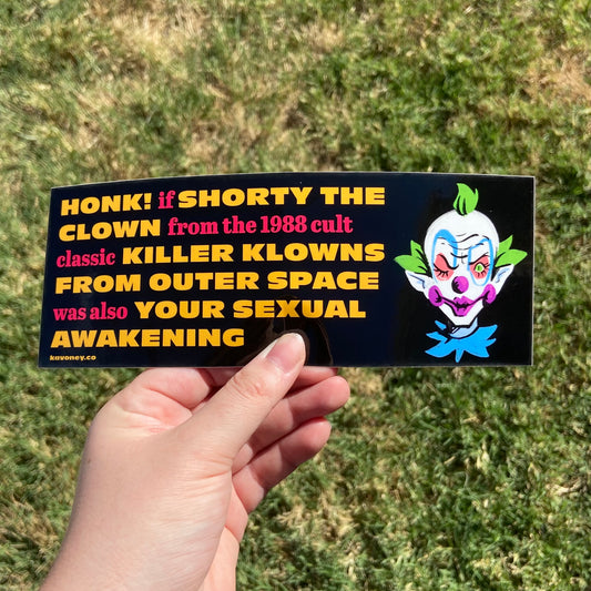 A black rectangular vinyl sticker featuring large text that reads “Honk if Shorty the Clown from the 1988 cult classic Killer Klowns from Outer Space was also your sexual awakening” in red and yellow font. To the right of the text is an illustrated depiction of Shorty winking.
